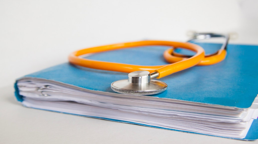 Medical records and stethoscope