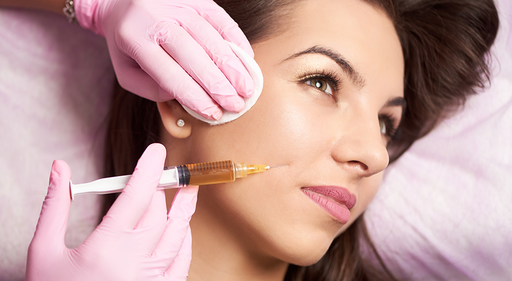 woman receiving a facial injection