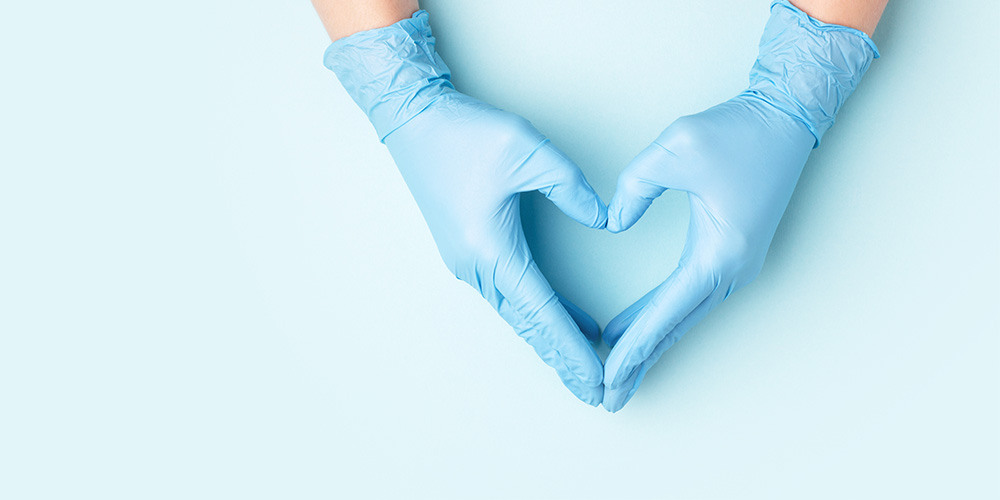 Gloved hands heart