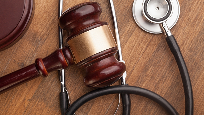 Laws, gavel and stethoscope