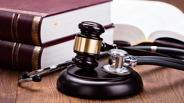 Medical law: books, gavel and stethoscope