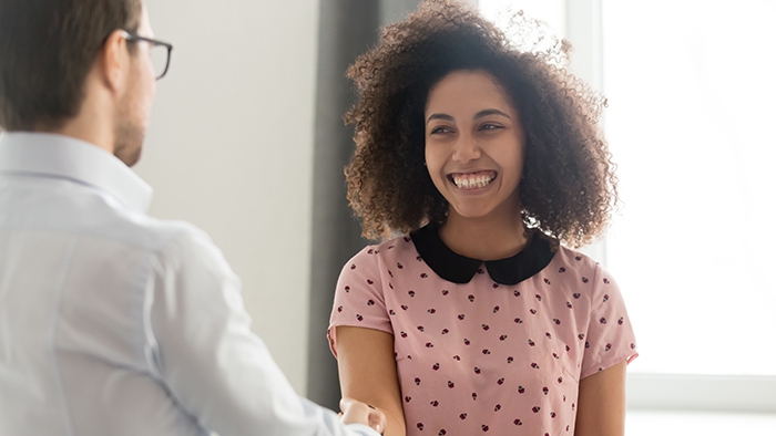 provider shakes hand with woman