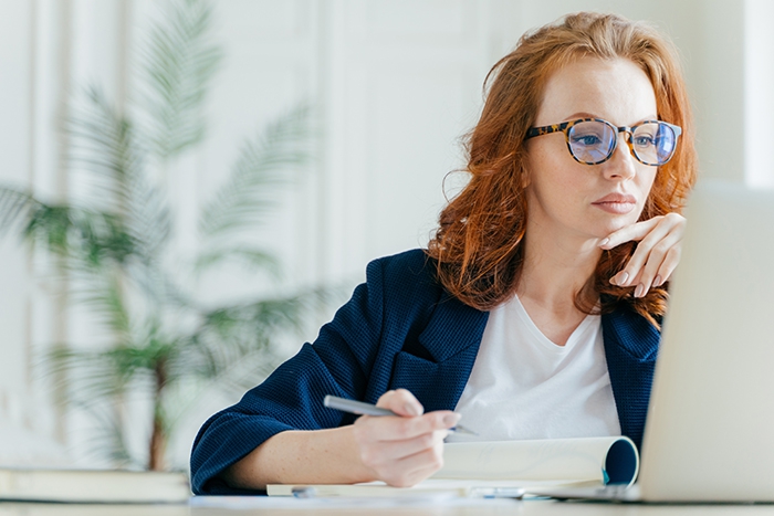 Woman researches on computer