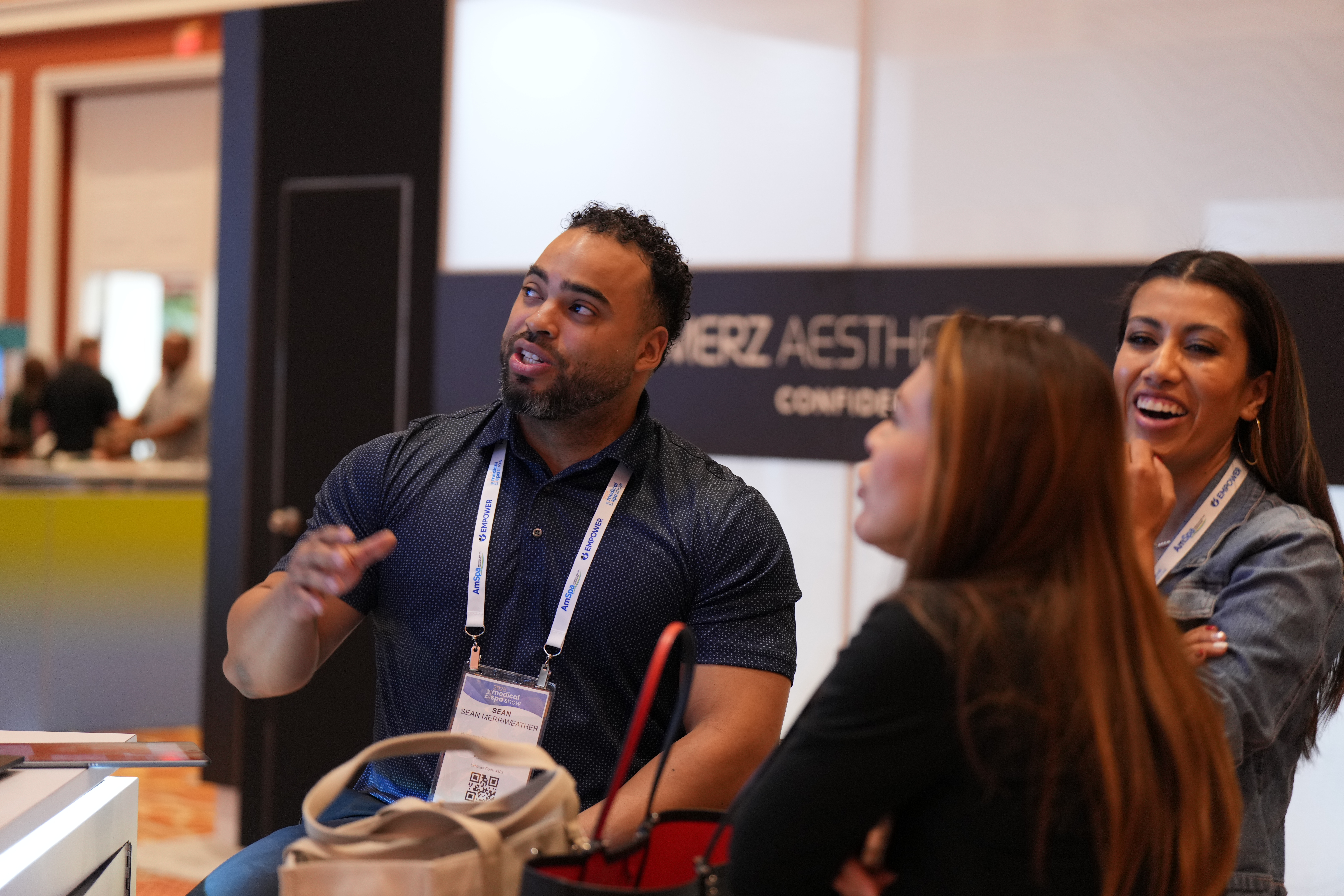 Attendees chat with vendors at AmSpa's MSS 2025.